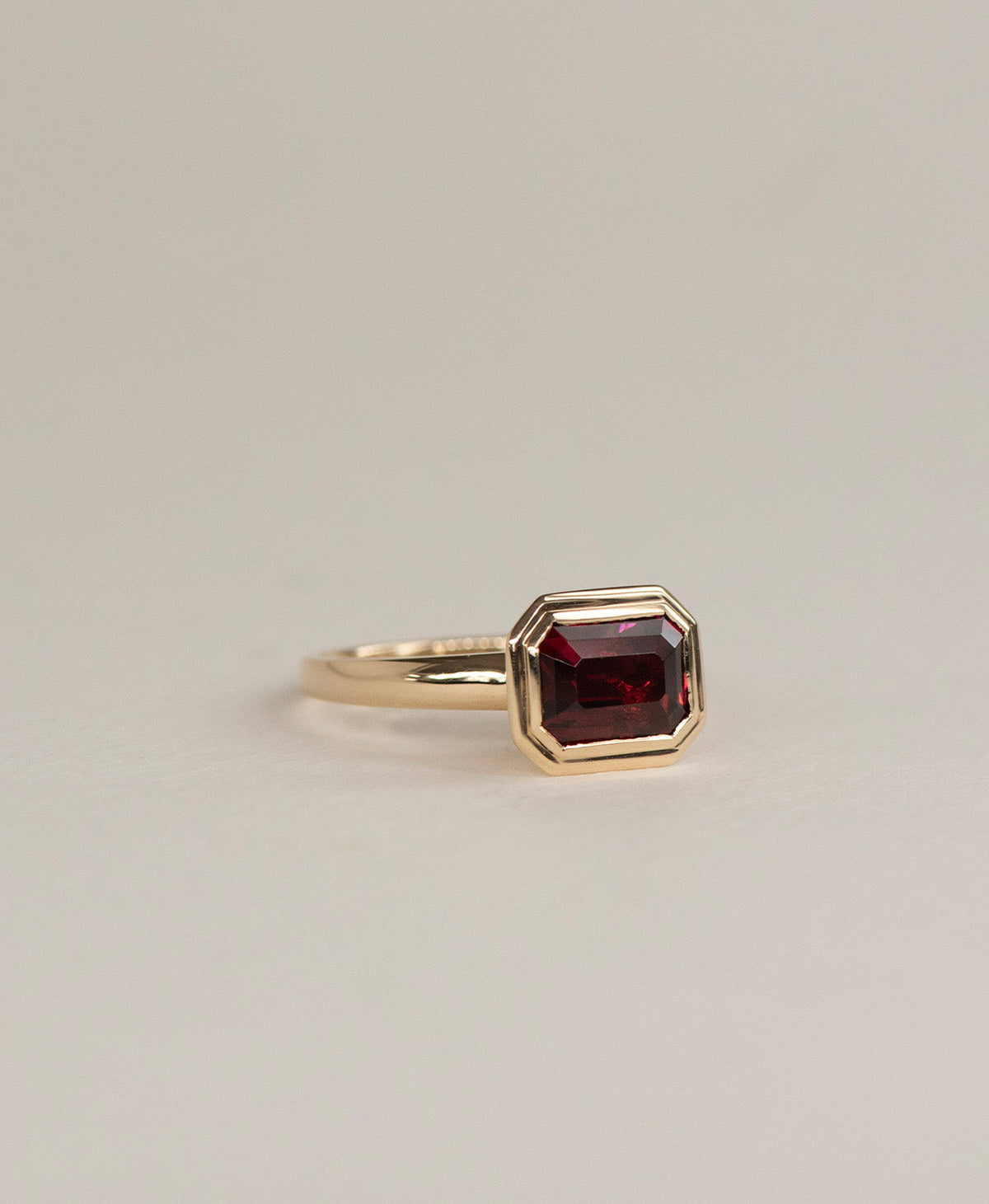 Delphine Engagement Ring - 9k Yellow Gold, Emerald Cut Garnet 2.87 carat