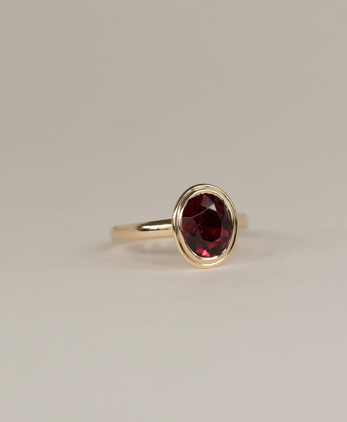 Delphine Engagement Ring - 9k Yellow Gold, Oval Cut Garnet 3.0 carat