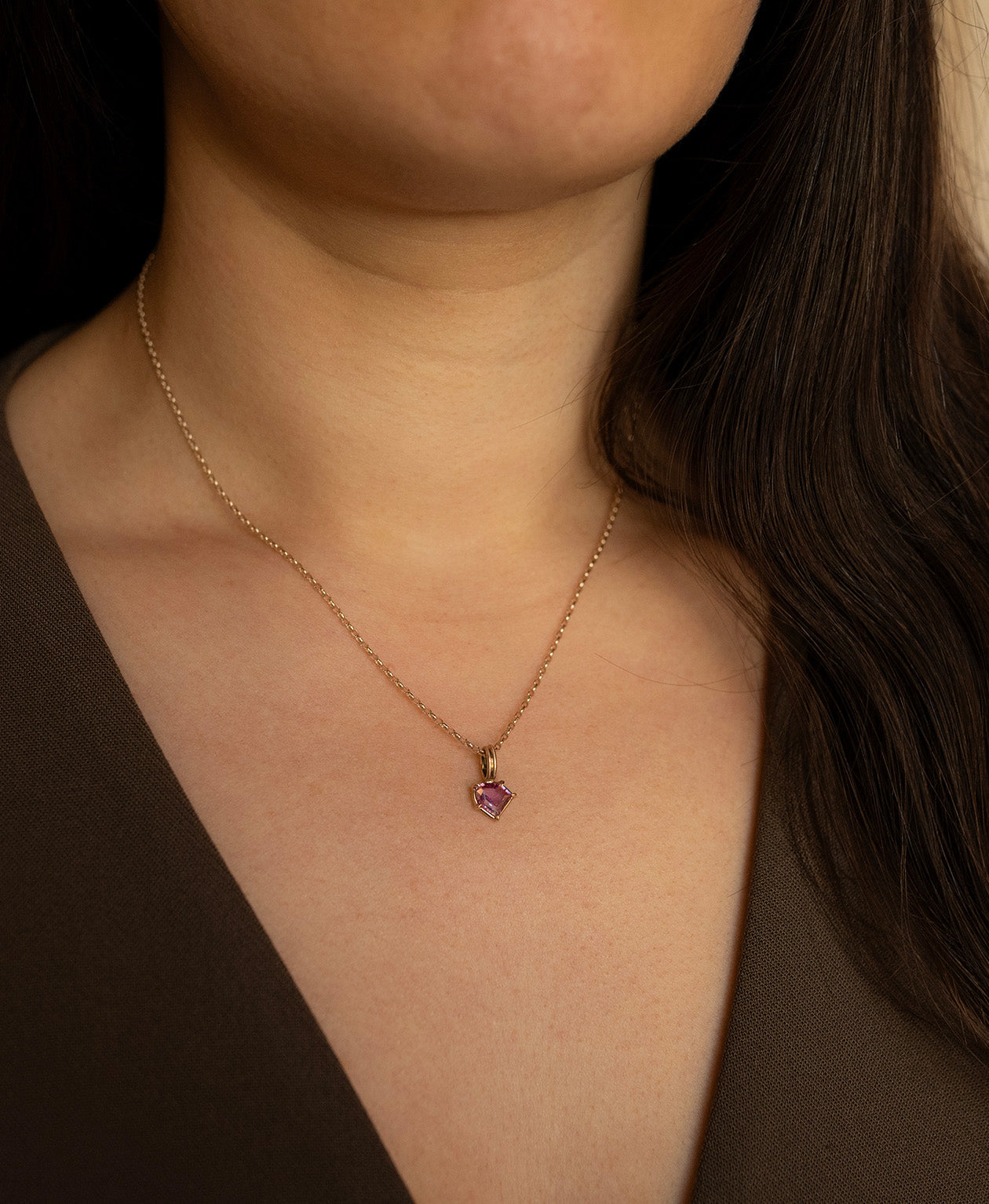 One of a Kind Charm 494 with a vibrant fuchsia pink portrait cut Sapphire on a fine belcher chain.