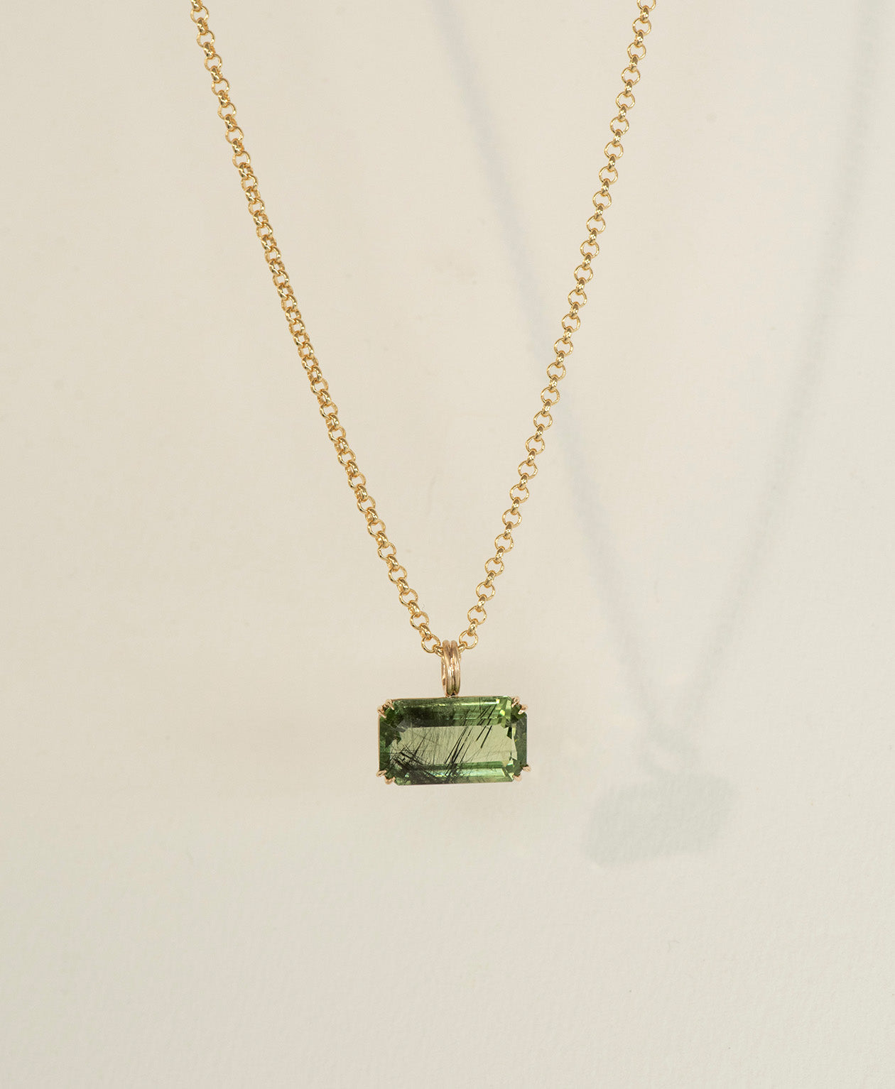 One of a Kind Charm 513 with a  deep green emerald cut Peridot on a belcher chain.
