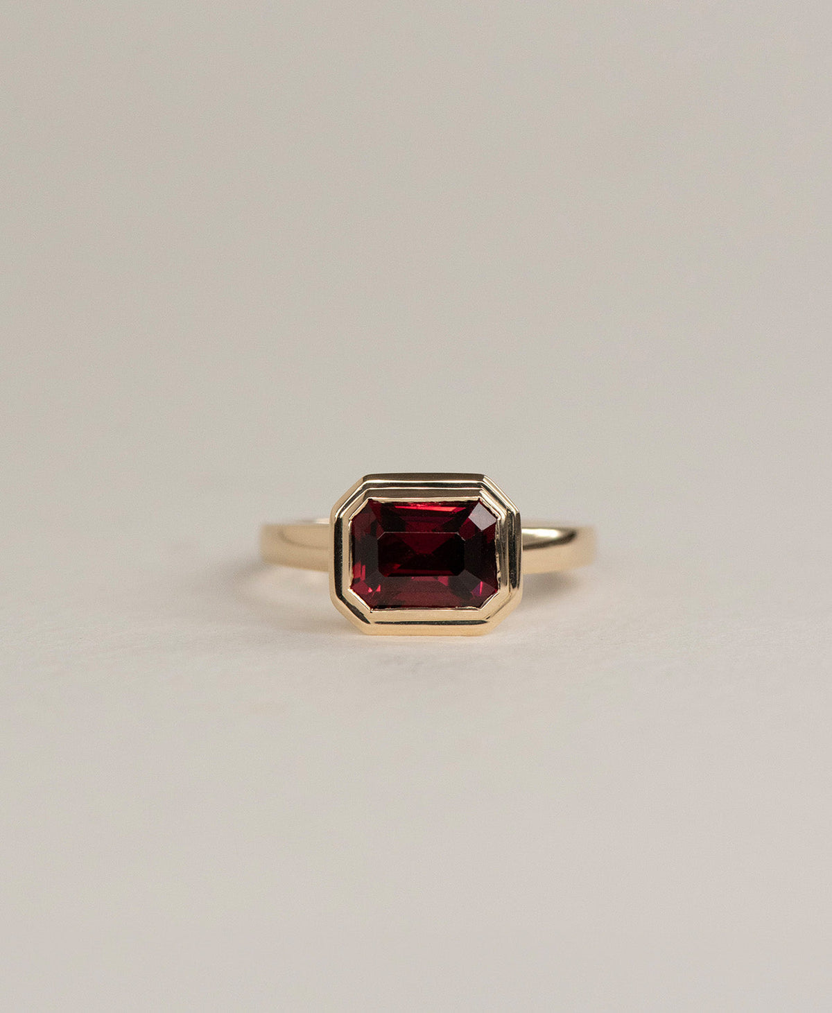 Delphine Engagement Ring - 9k Yellow Gold, Emerald Cut Garnet 2.87 carat